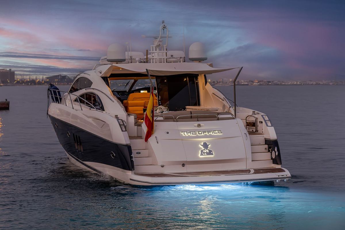 Sunseeker Predator 72 lit up at dusk